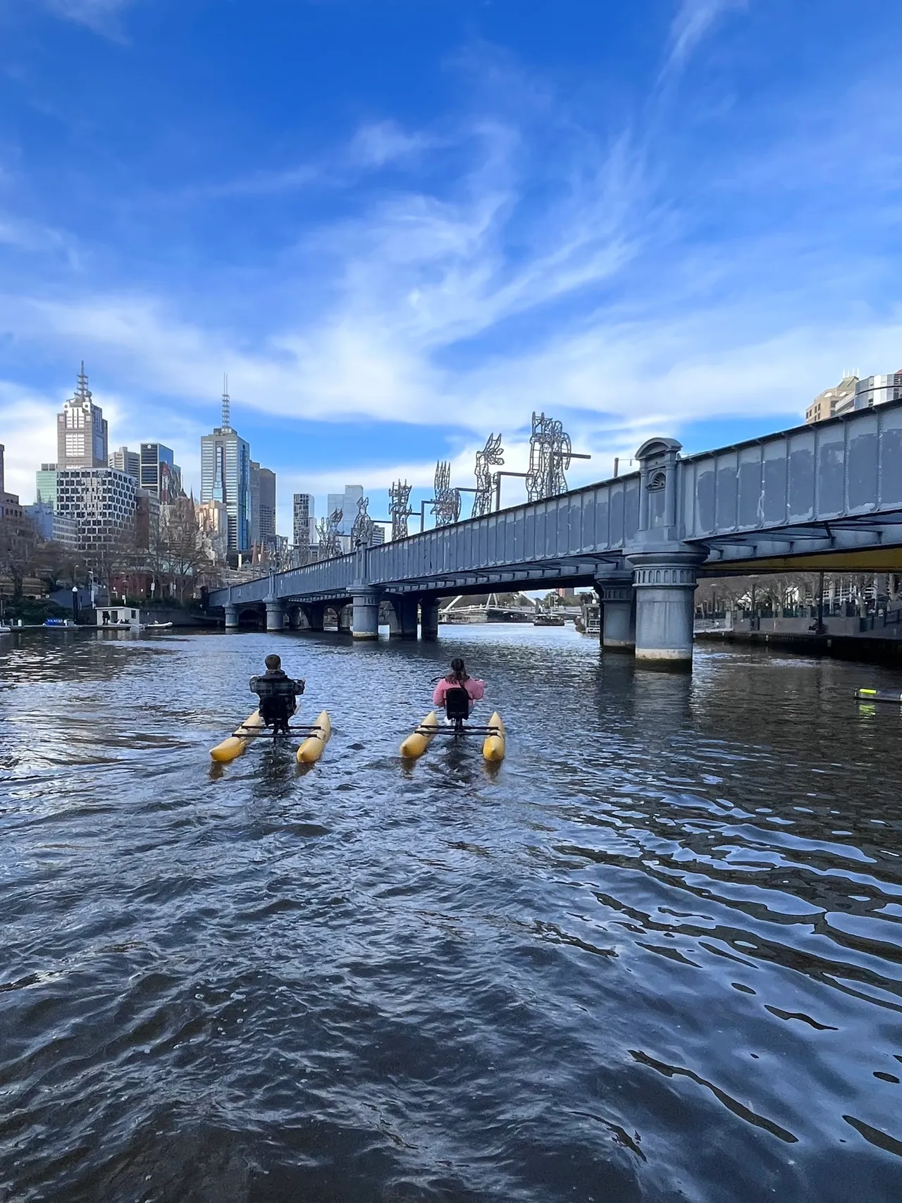 Couple waterbiking on the Yarra River in Melbourne