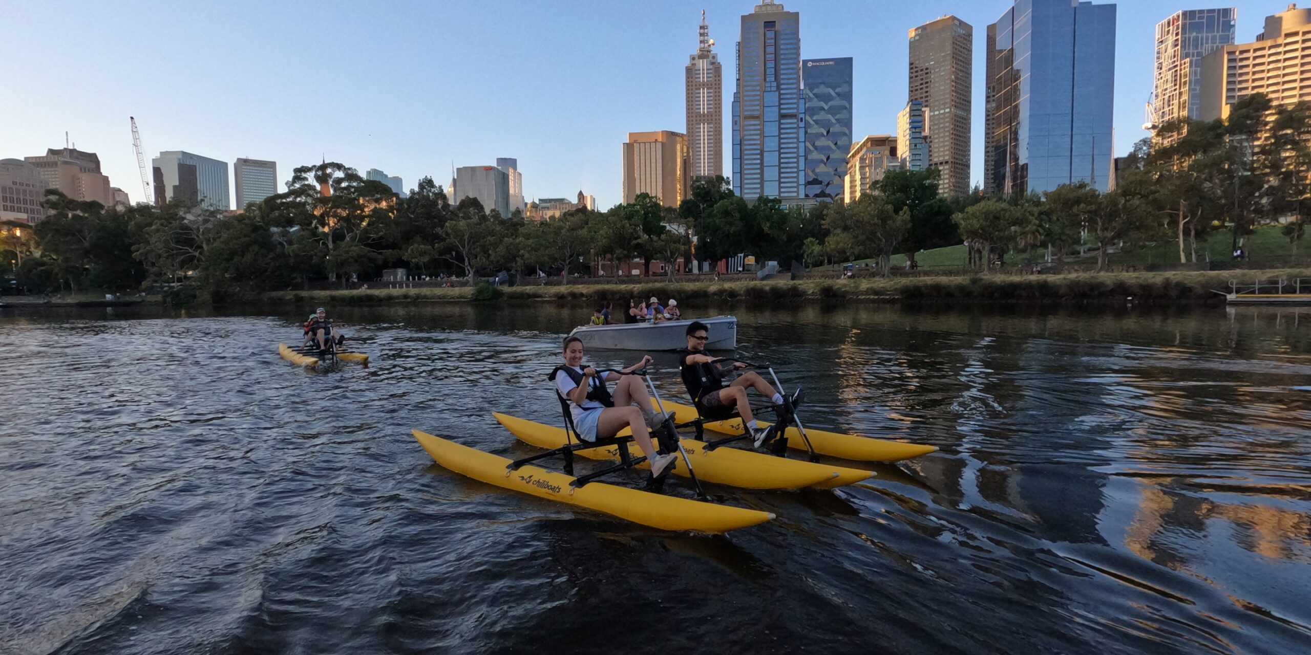 Group waterbiking on the Yarra River in Melbourne at twilight